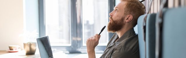 side-view-man-thinking-while-working